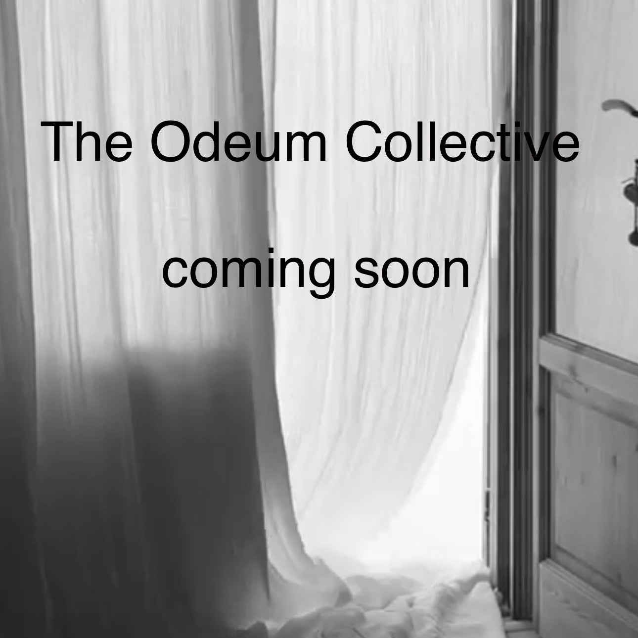 Curtains partially open with 'The Odeum Collective coming soon' text.